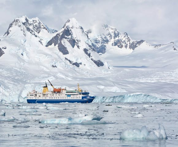 Ocean Nova, Antarctic Vessel amongst icebergs in Antarctica