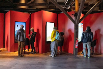 People use the touchscreens to discover information about Antarctica at Explorers House