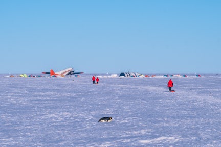 Tents and ski plane at Gould Bay emperor penguin camp in Antarctica