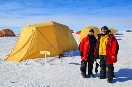 Tourists in front of tents at South Pole camp