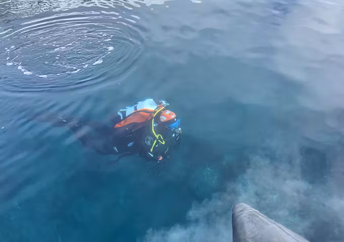Scuba diving off a zodiac boat in Antarctica