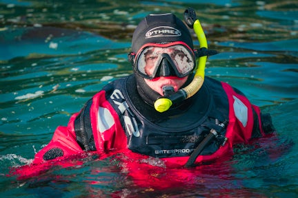 A snorkeller comes up for air in the Antarctic