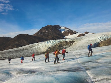A group of trekkers are roped together as they climb the Fortuna Glacier on the Shackleton Crossing in South Georgia