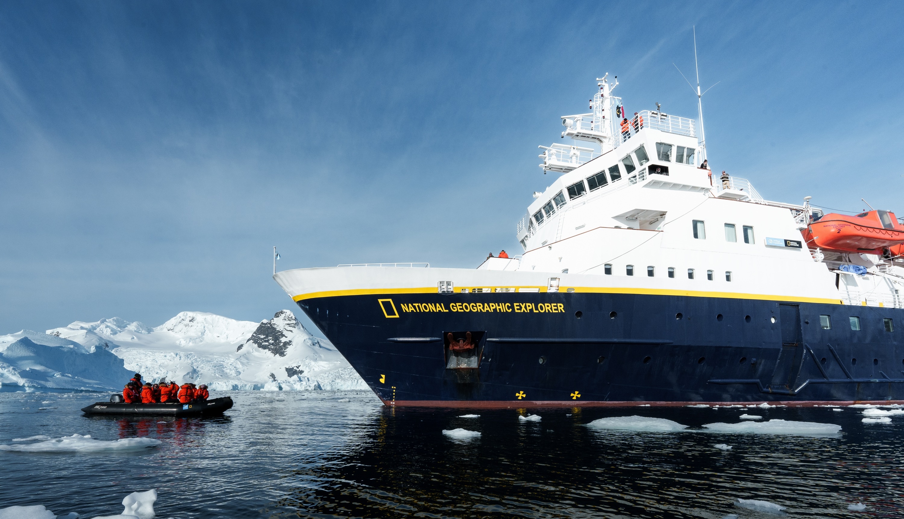 The National Geographic Explorer Antarctic ship and a zodiac sail in Antarctica 