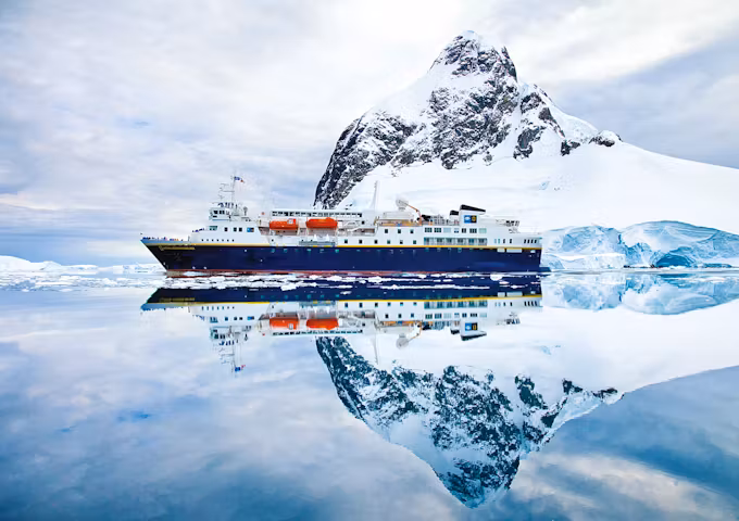 The National Geographic ship glides through the Lemaire Channel in Antarctica