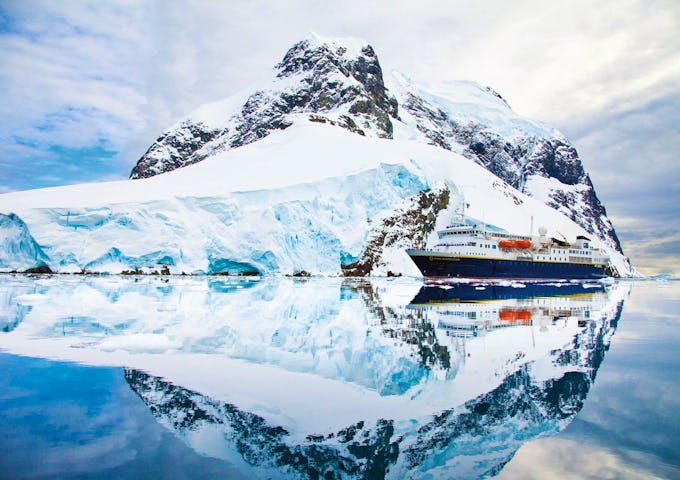 The National Geographic ship glides through the Lemaire Channel in Antarctica