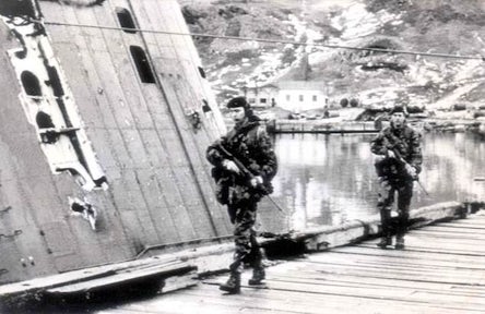 Two British Royal Marines patrolling the dock in Grytviken, South Georgia
