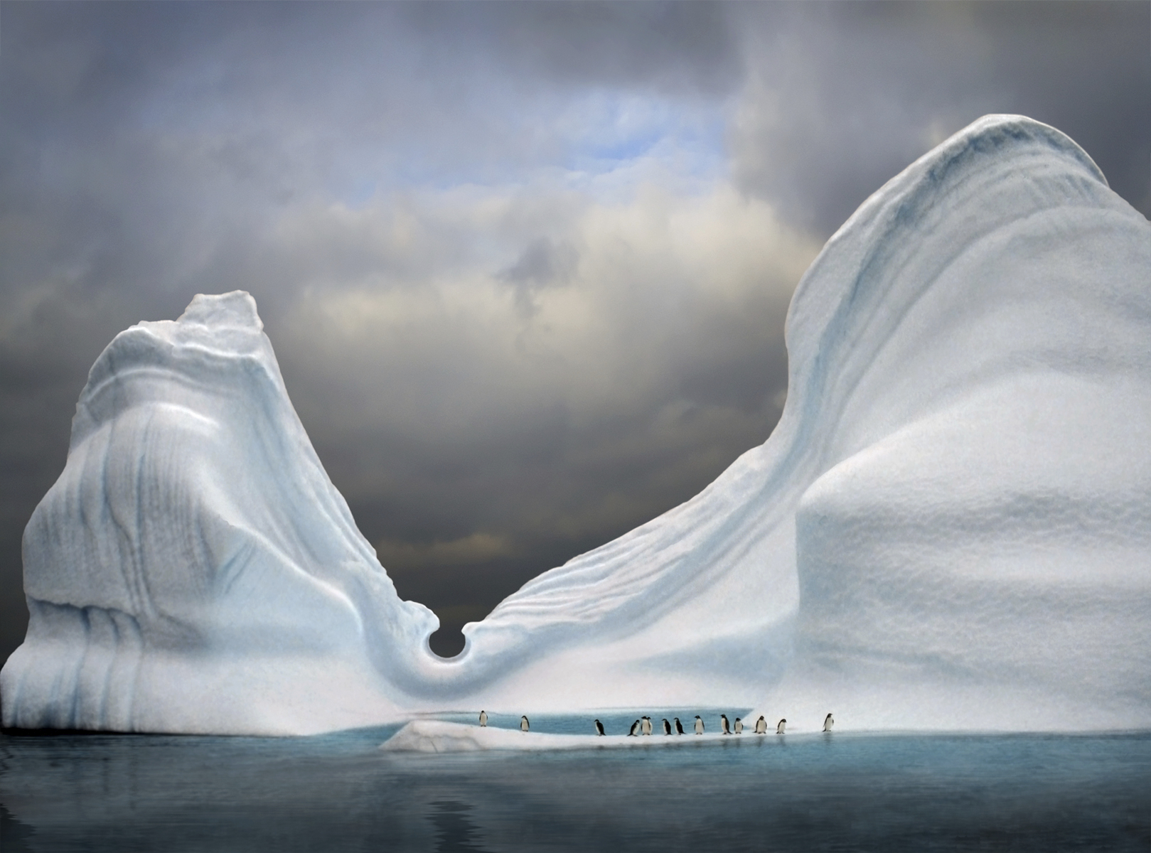 Penguins among icebergs, Antarctica