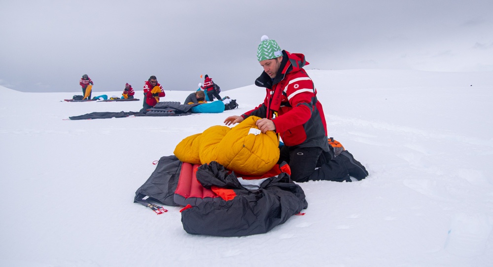 A man sets up his camp in Antarctica