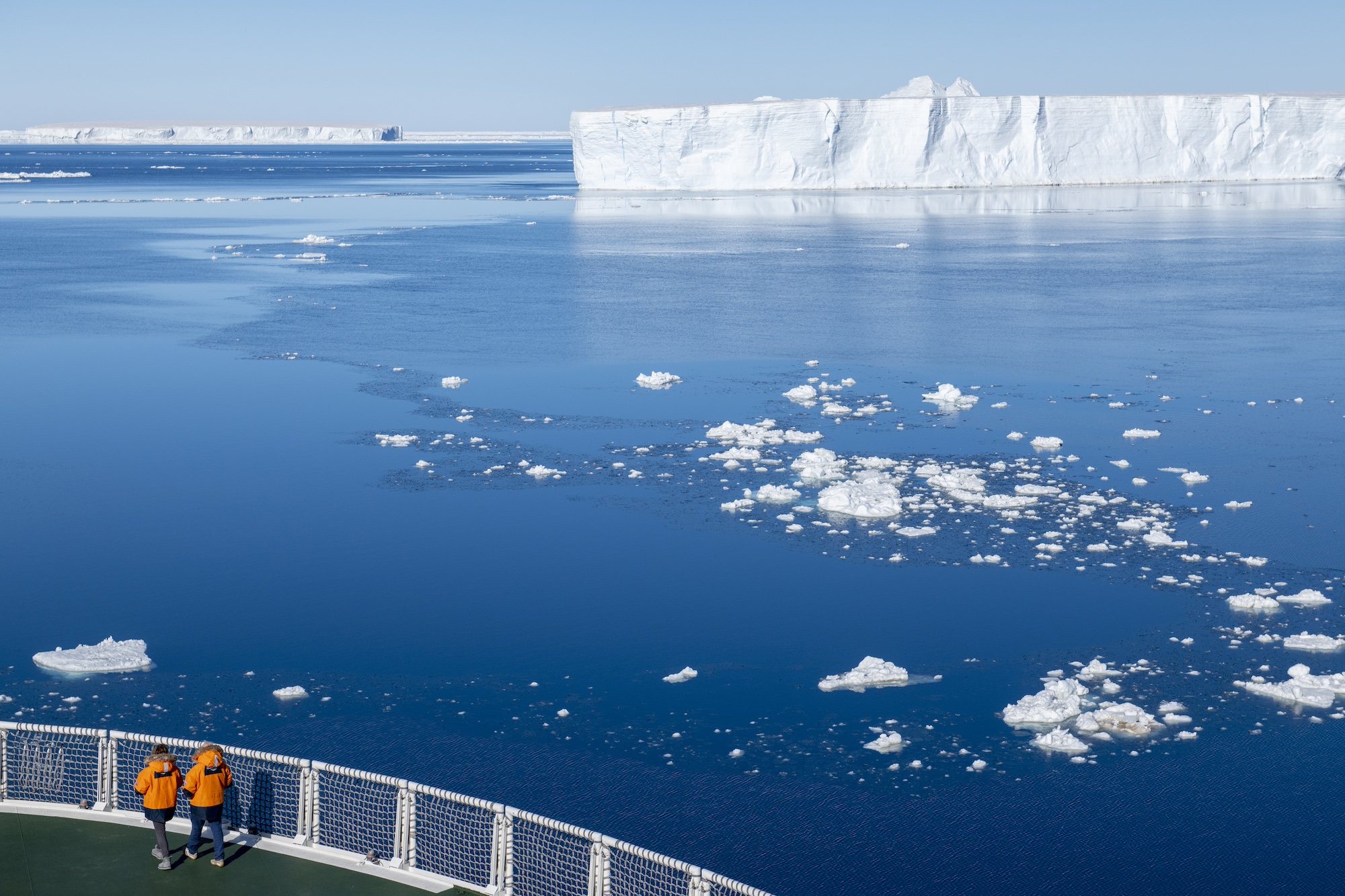 Two people look out across the Weddell Sea on a cruise to Antarctica 