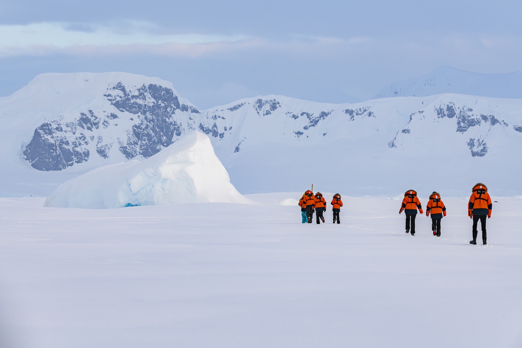 Travellers trudge through the snow during an Antarctic voyage on Le Commandant Charcot  