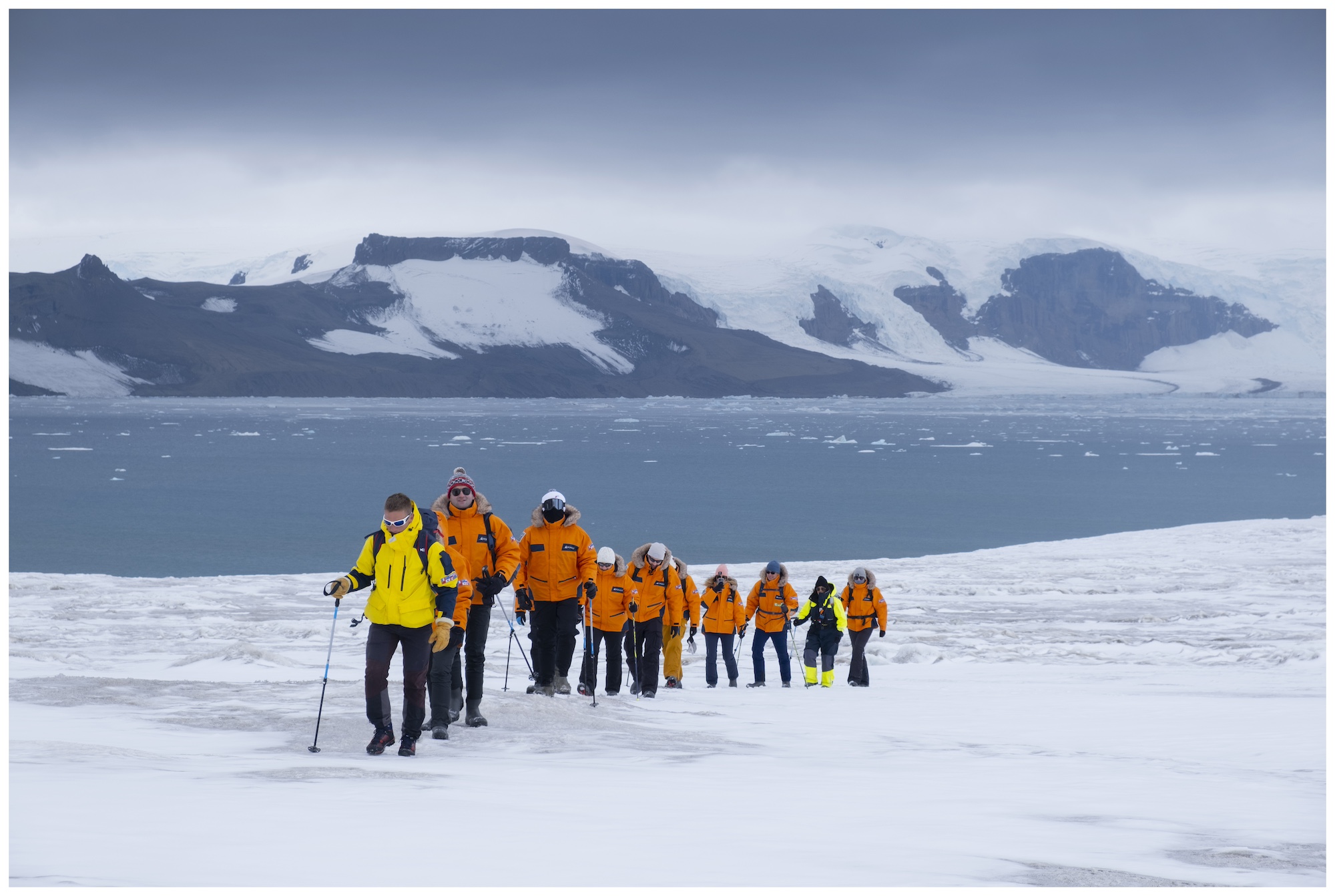A group of people hike in the Weddell Sea region, Antarctica