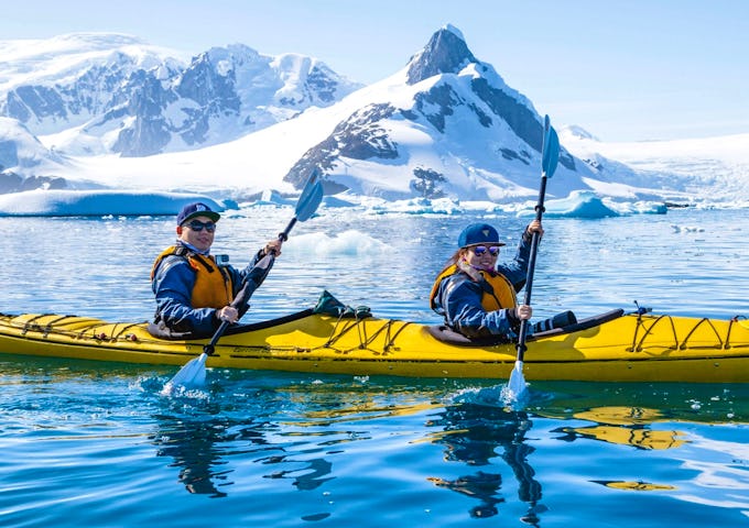 Two people kayaking in Antarctica