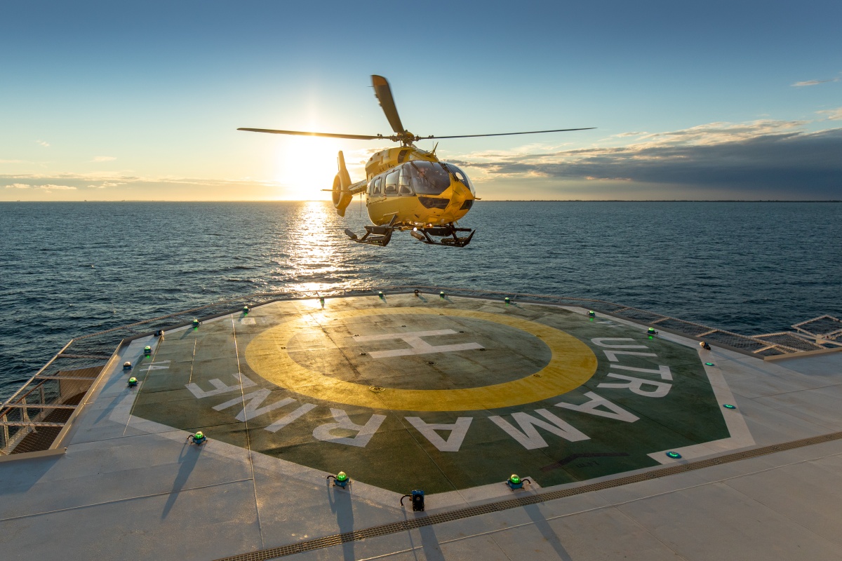 Helicopter landing on deck of Ultramarine Antarctic vessel in Antarctica
