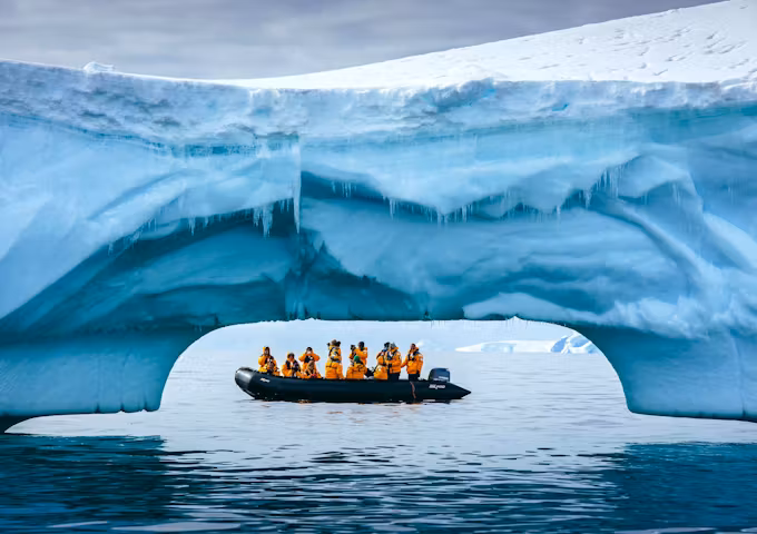 Zodiac cruise beside an iceberg