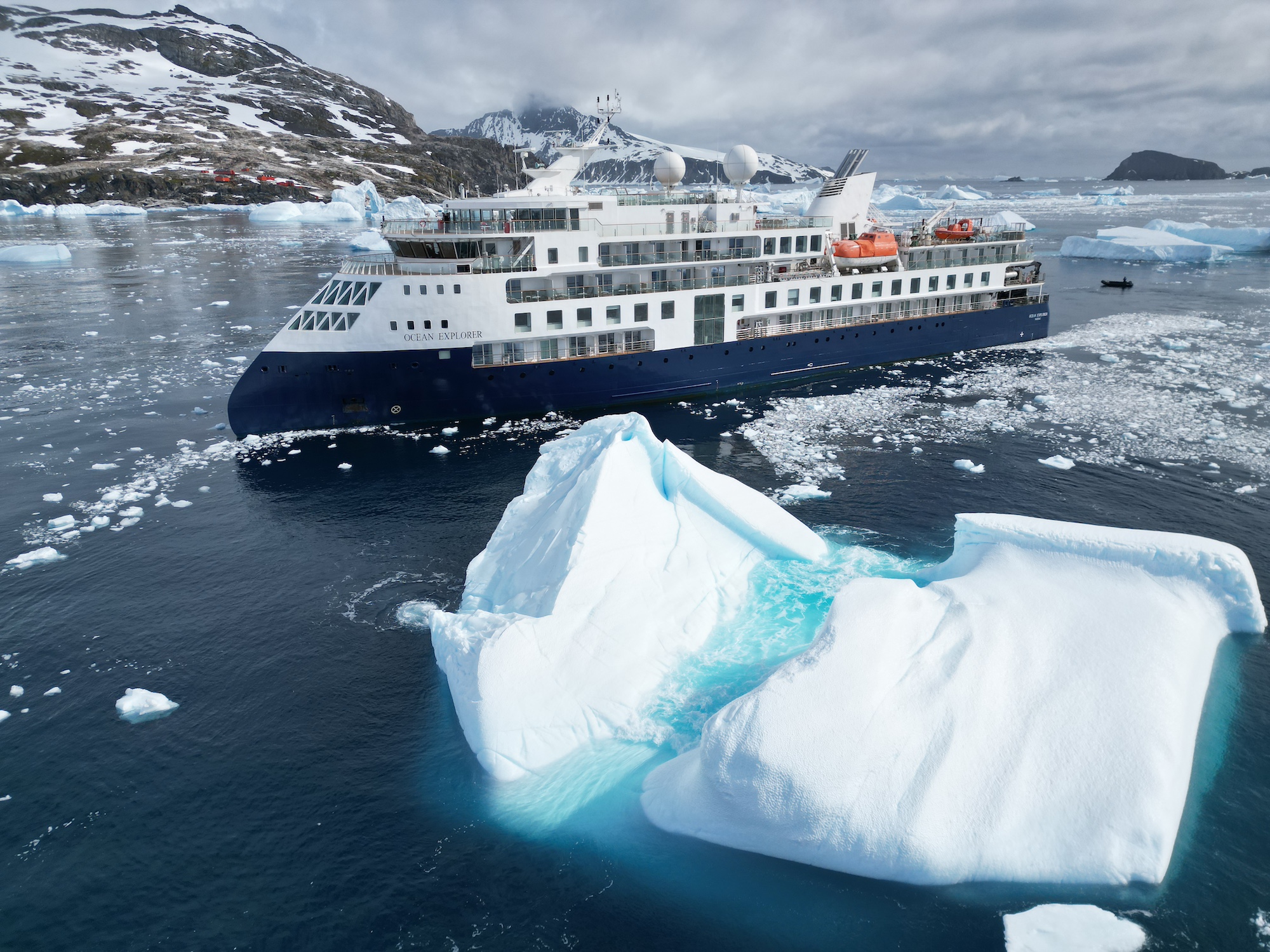 The Antarctic ship the Ocean Explorer and two large icebergs  