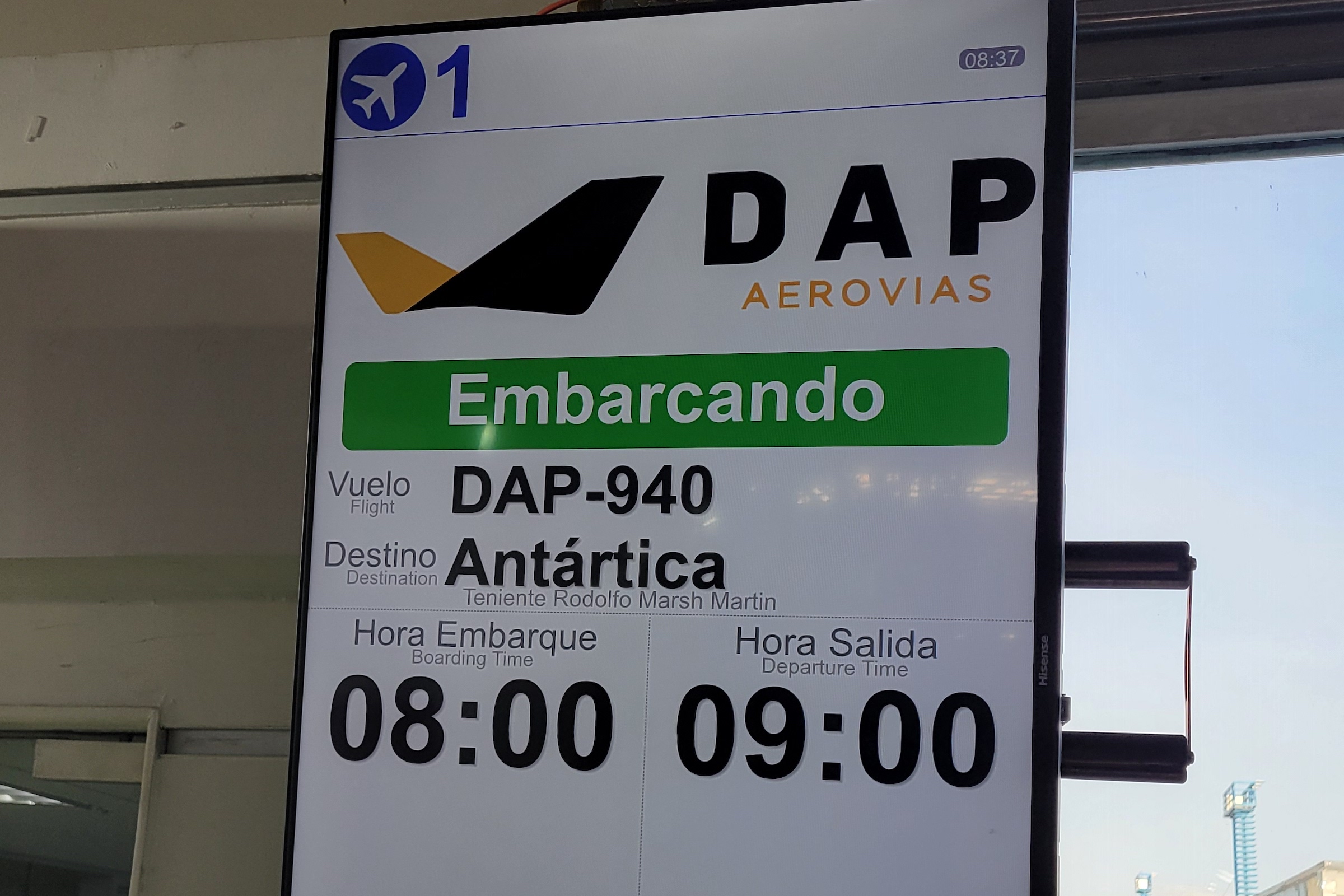 Departure board at Punta Arenas airport for flight to Antarctica