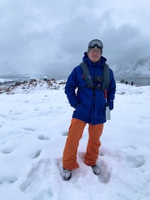 A man wears cosy, sustainably sourced gear in Antarctica