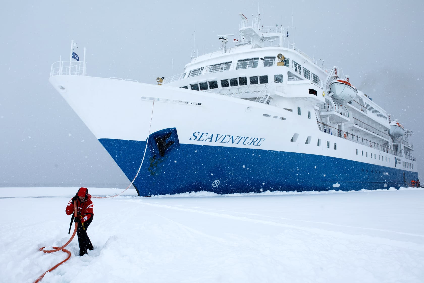 Colin, a Swoop sales team member, pretends to pull the Antarctic Seaventure ship out of the ice