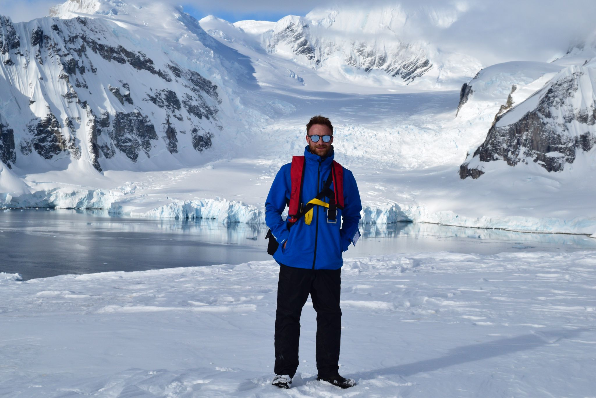 Swoop team member Daniel stands in the snow in Antarctica 