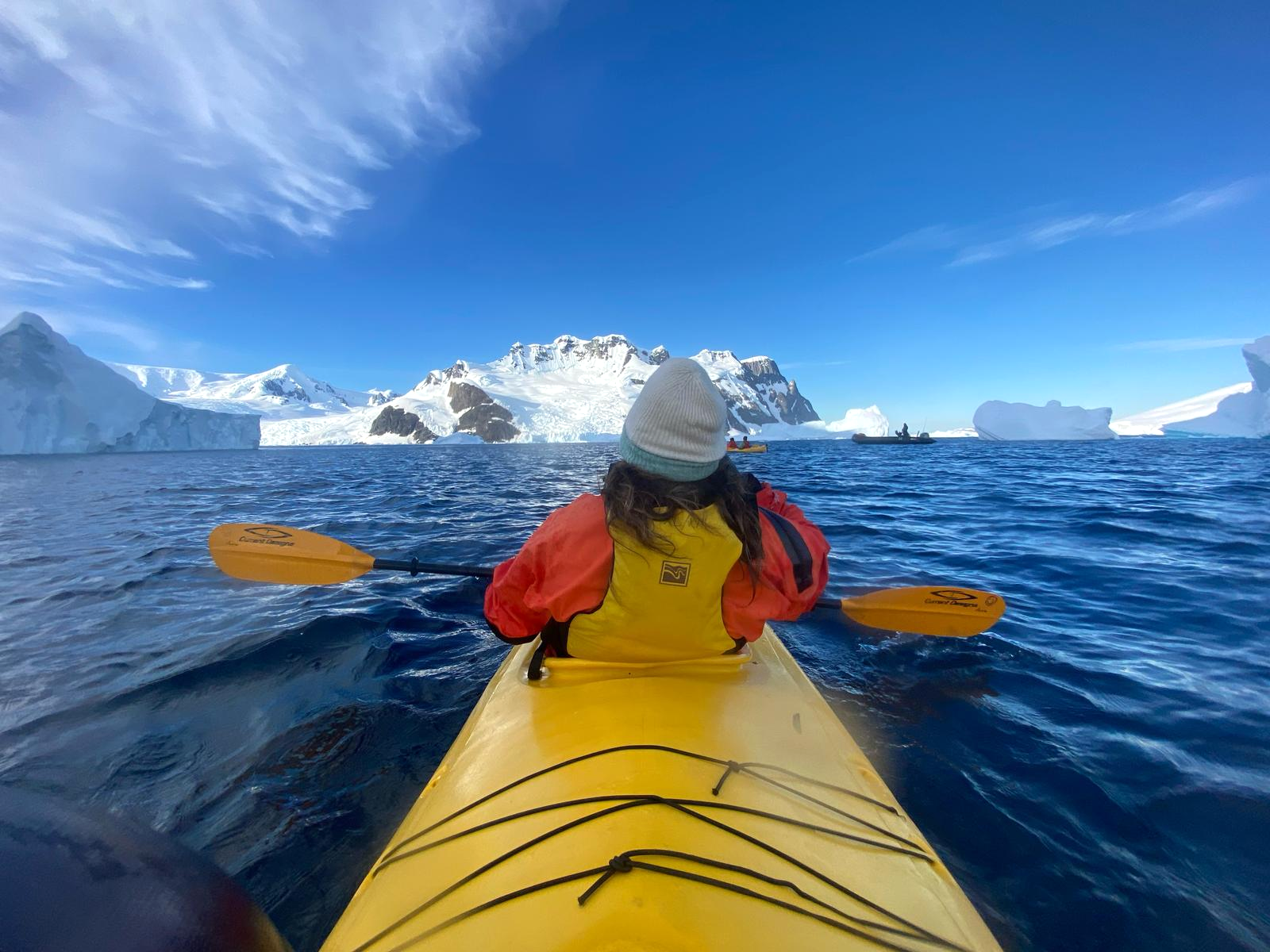 The back of Swoop team member, Mel, as she kayaks in Antarctica
