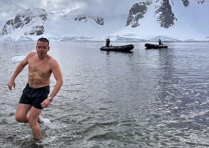 Ian runs out of the sea after doing the polar plunge