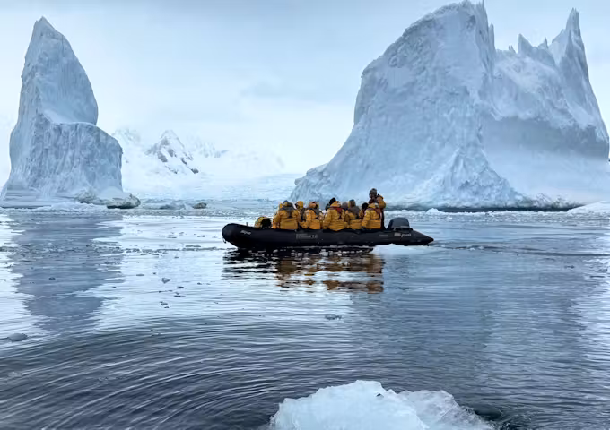 Zodiac cruising in Mikkelsen Harbor, Antarctica, with its impressive icy background