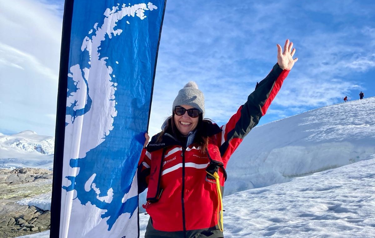 Louise from Swoop celebrates being on the 7th Continent 