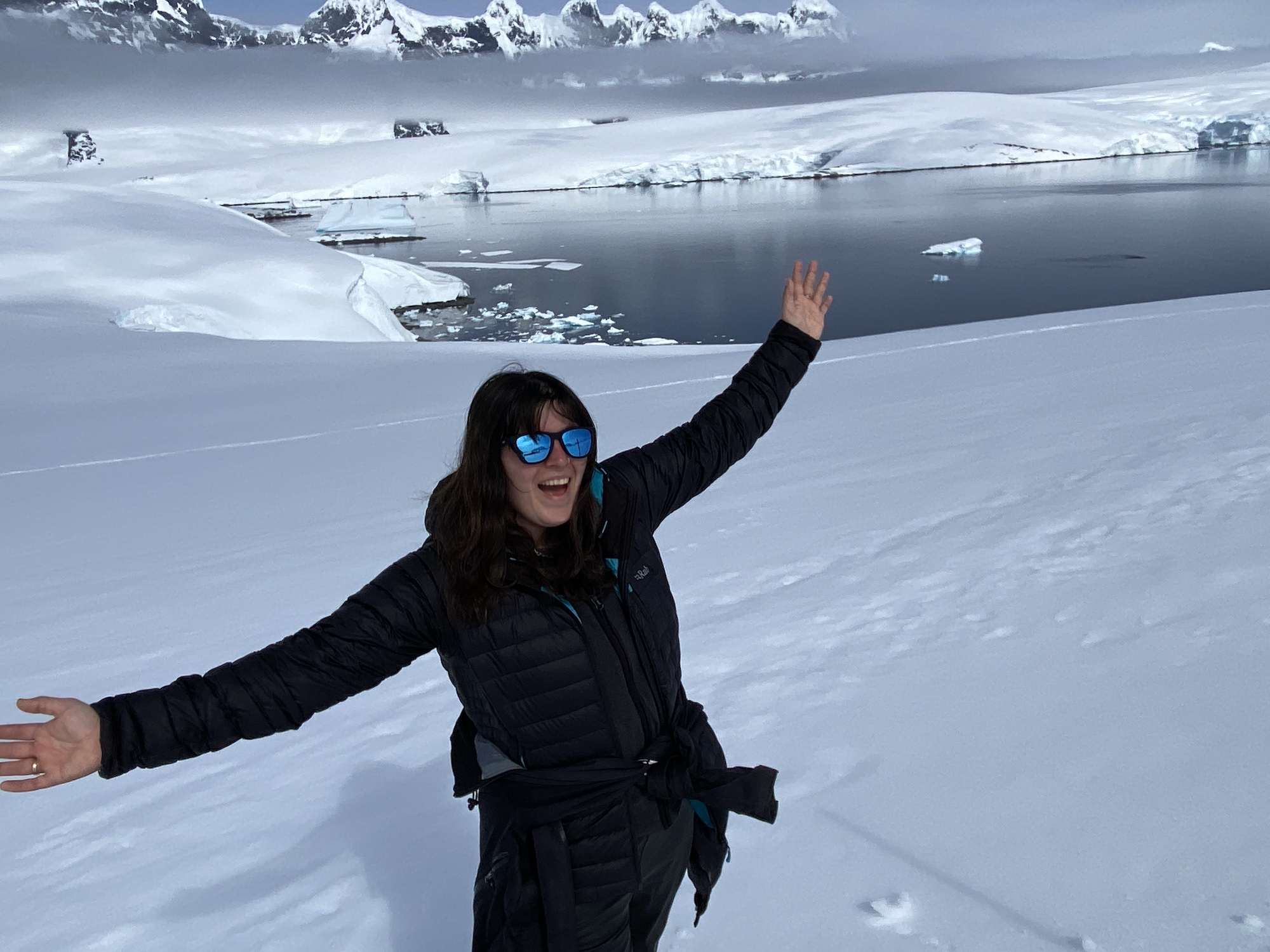 A woman looks excited at Damoy Point, Antarctica 