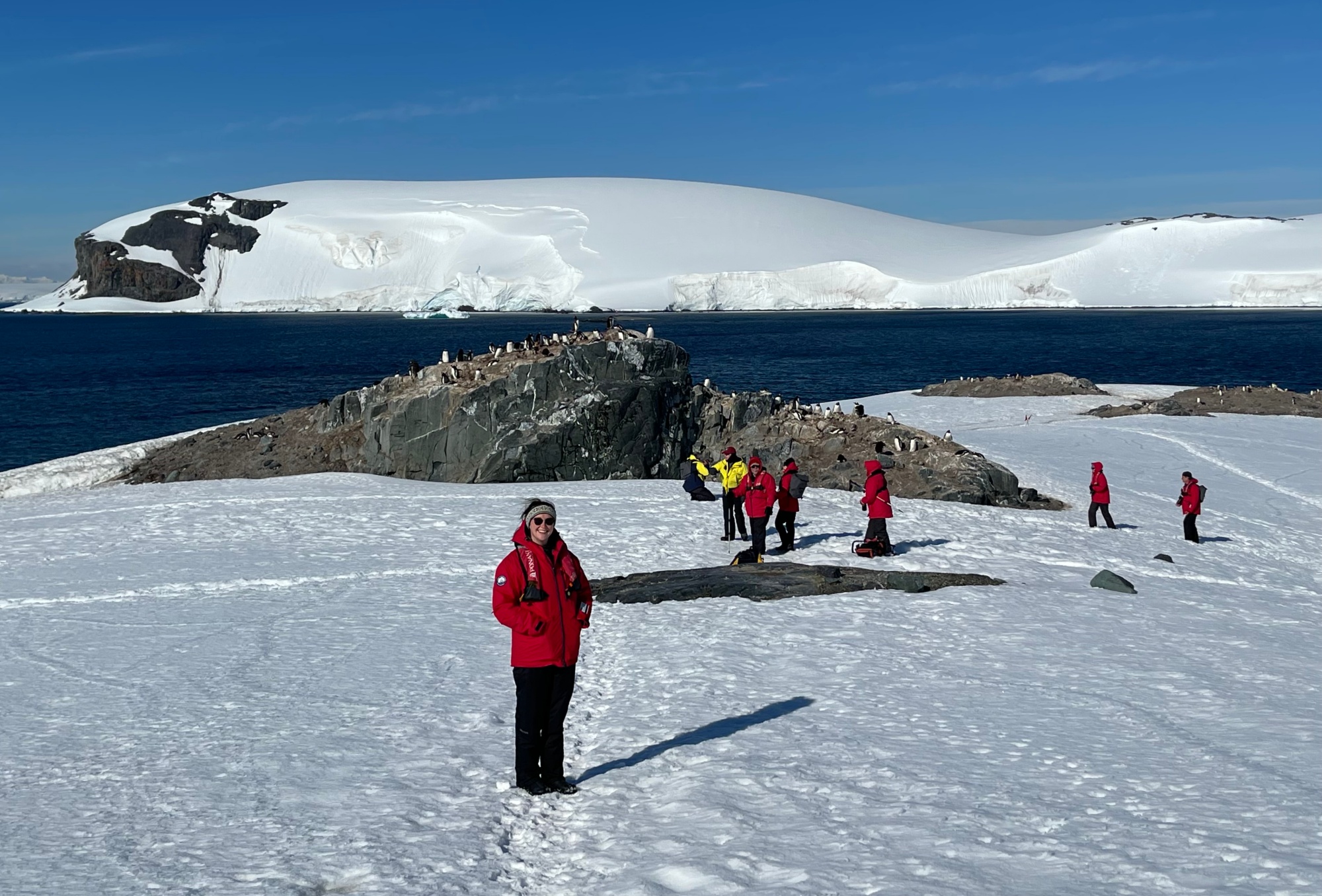 A woman stands in the snow