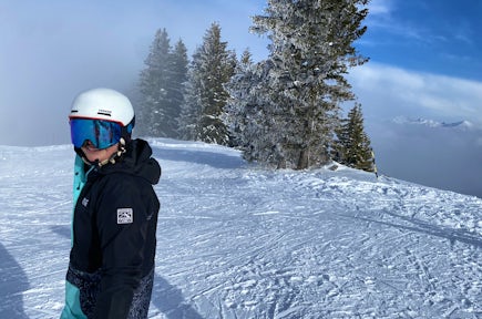 A woman snowboards in France