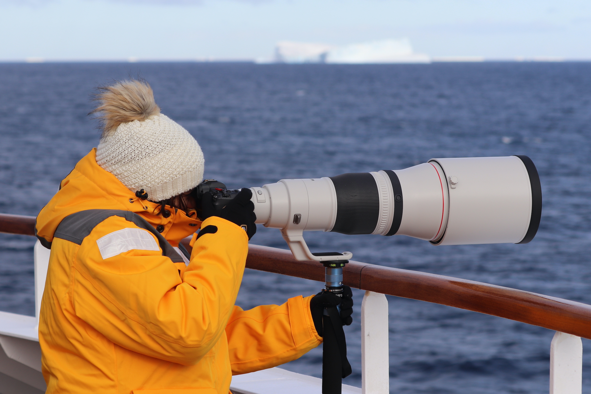 Photographer with long lens camera in Antarctica