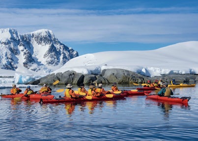 A groups of kayakers on the Antarctic Peninsula