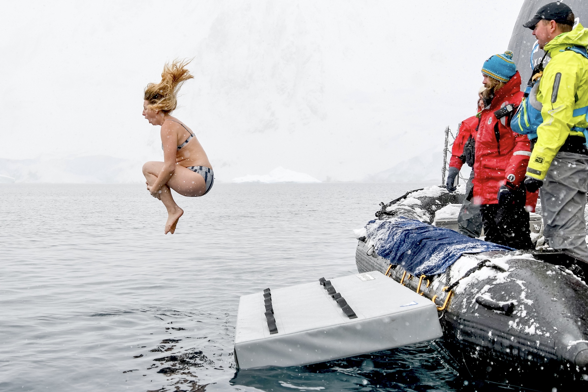 Female tourist doing the polar plunge in Antarctica