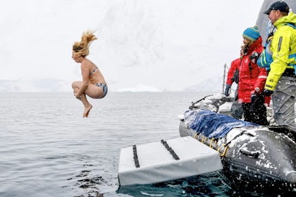 Female tourist doing the polar plunge in Antarctica