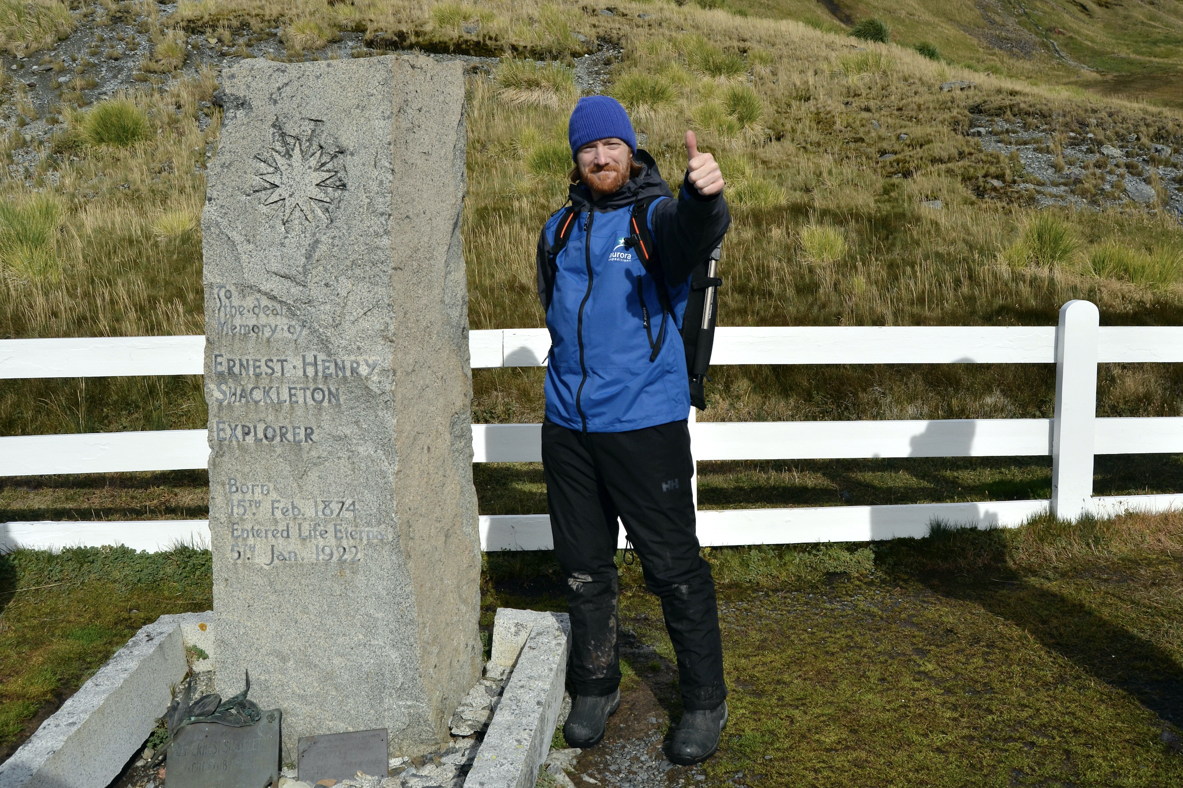 Tourist at Shackleton's grave in Grytviken
