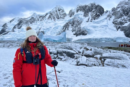 Female tourist in the snow on the Antarctic peninsula