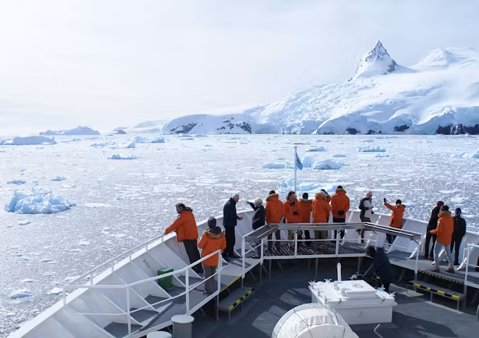 Bow view from the NG Explorer expedition cruise ship sailing through the Antarctic ice