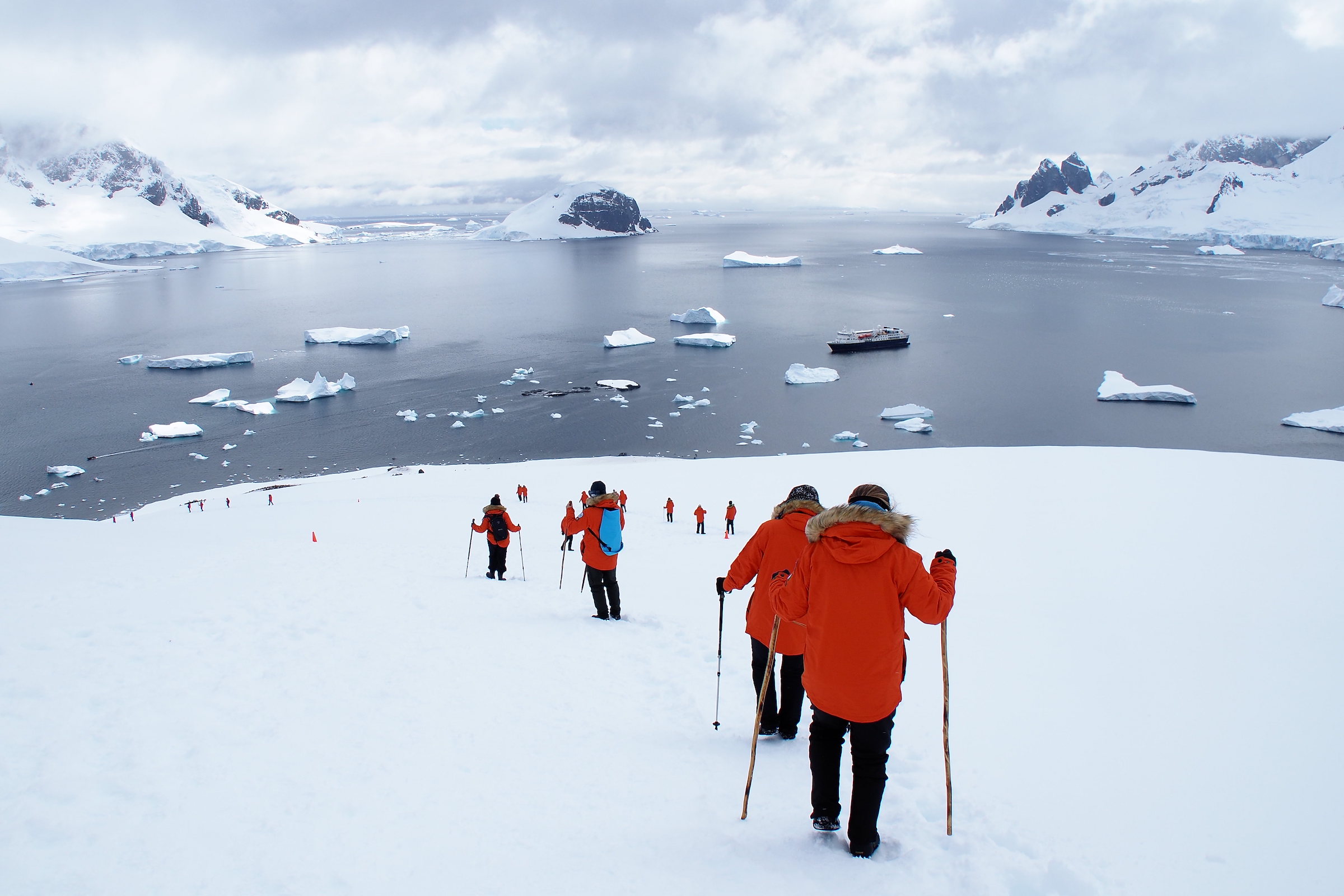 Hikingin the snow in Danco Island on the Antarctic Peninsula