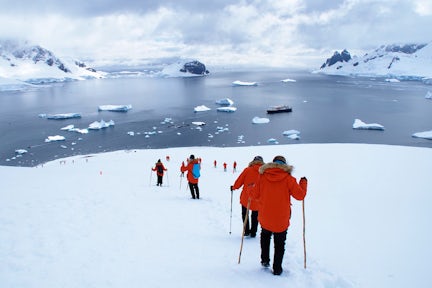 Hikingin the snow in Danco Island on the Antarctic Peninsula