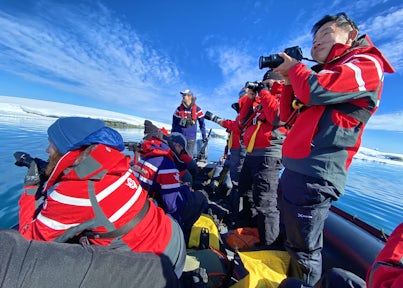 A zodiac full of photographers in the Antarctic peninsula