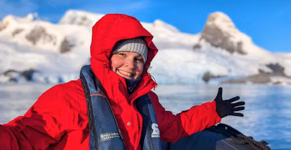 Swoop team member Mel smiles at the camera as she enjoys Antarctica