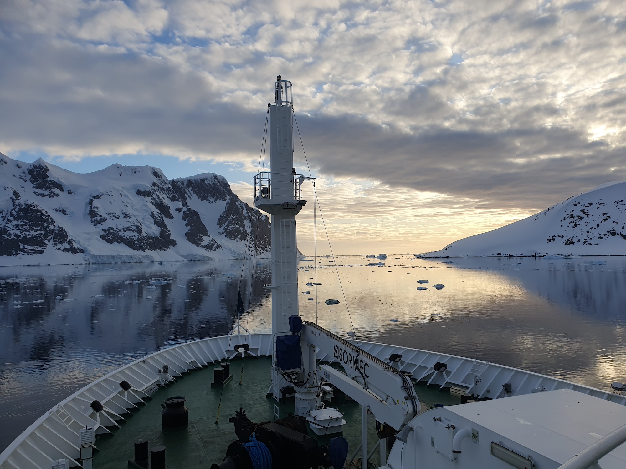 Antarctic scenery and the bow of a ship, taken by Ian Young on recce