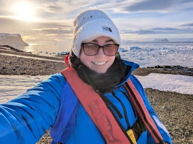 Swoop team member Madelyn takes a sunset selfie in Antarctica