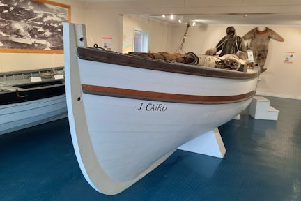 A replica of Shackleton's James Caird boat sitting in the South Georgia Museum in Grytviken