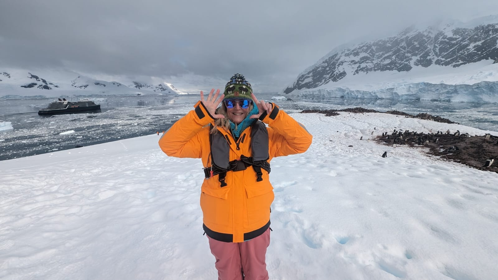 A woman celebrates as she sets foot on the 7th Continent 