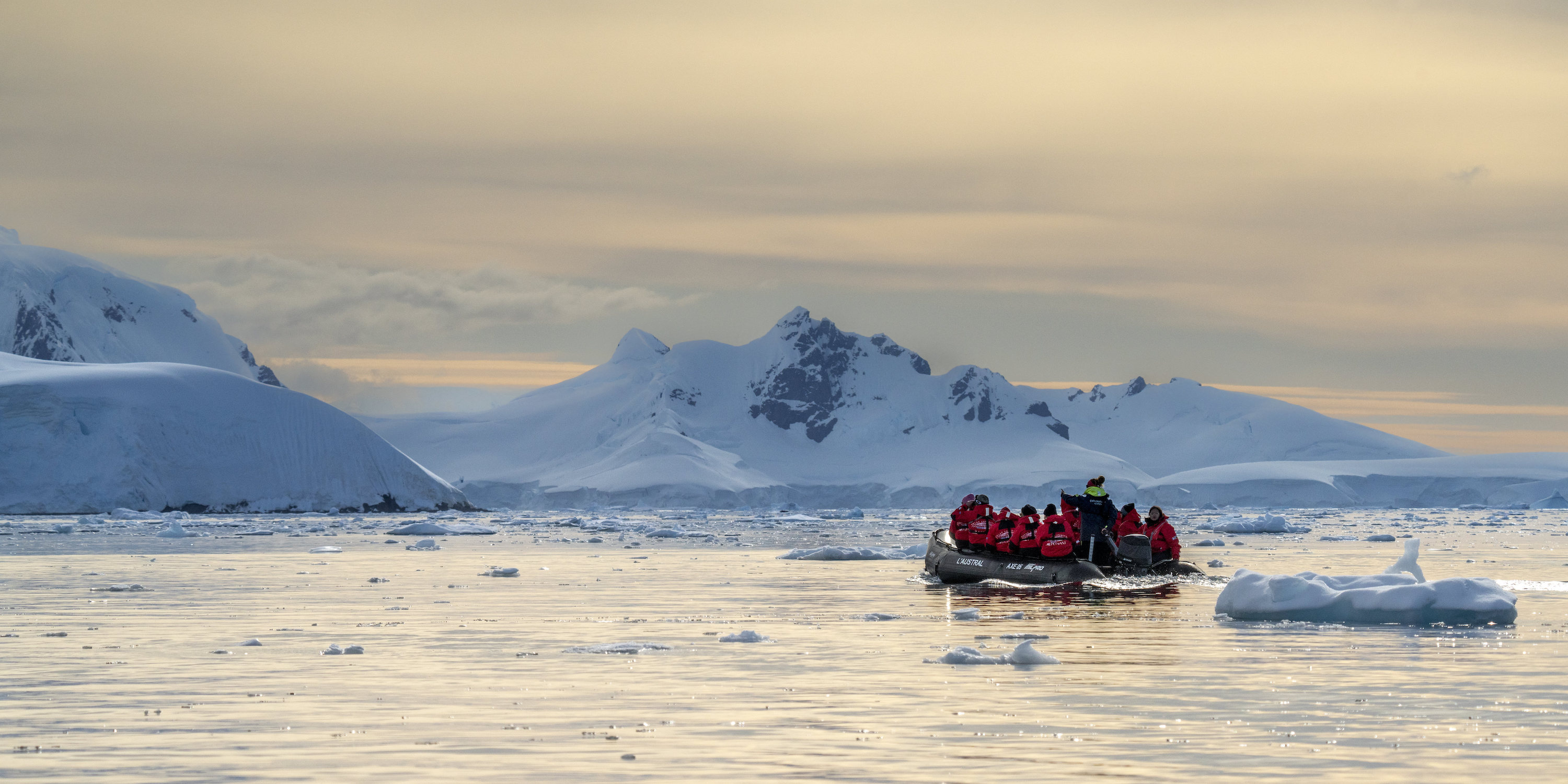 Zodiac cruising during a late season sunrise in Wilhemina Bay