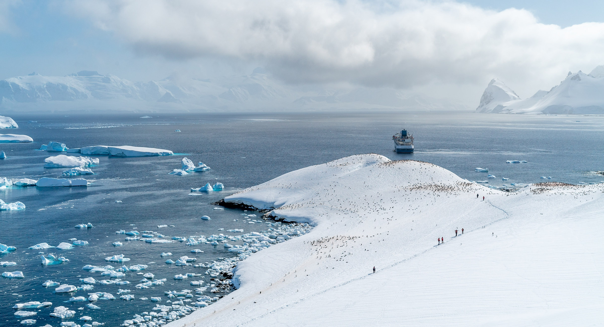 Long distance view of Cuverville Bay with Seaventure