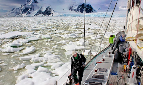 Deck view of a yacht sailing through brash ice in the Southern Ocean