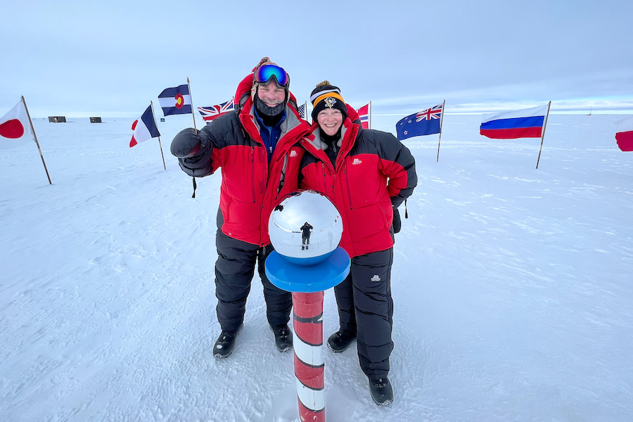 Two tourists at the South Pole